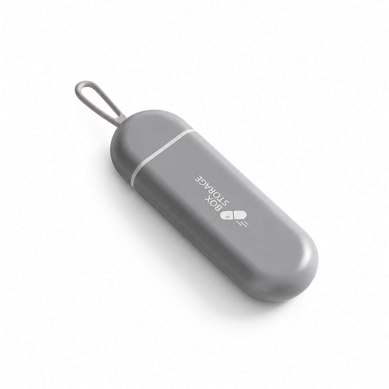 UNTIOR grey pull-out pill case in closed view with compact capsule shape, hanging loop, and BPA-free daily tablet storage design.
