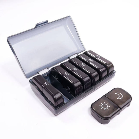 UNTIOR smoky black 14-compartment weekly pill organizer with 7 removable AM/PM daily cases, smoky protective cover, and compact daily case for weekly planning and travel-friendly routines.